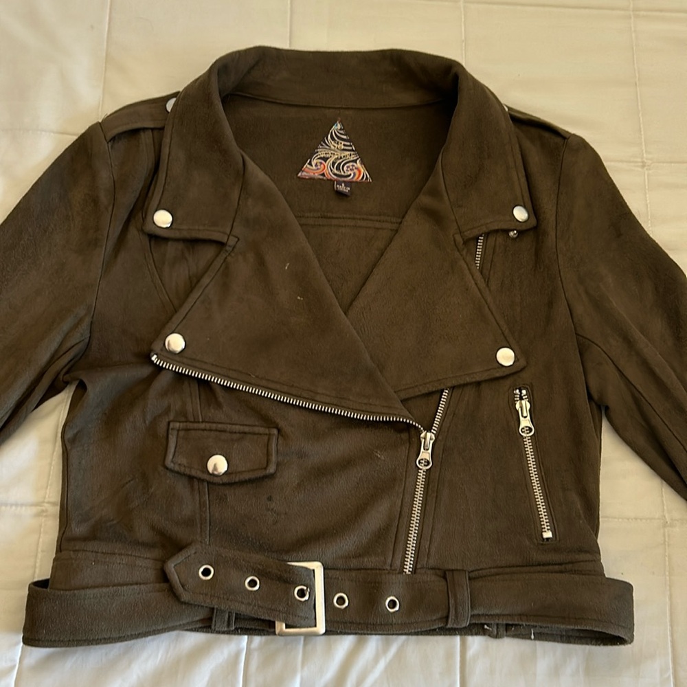 Olive green jacket with zippers only one small pocket Used, minor stains.